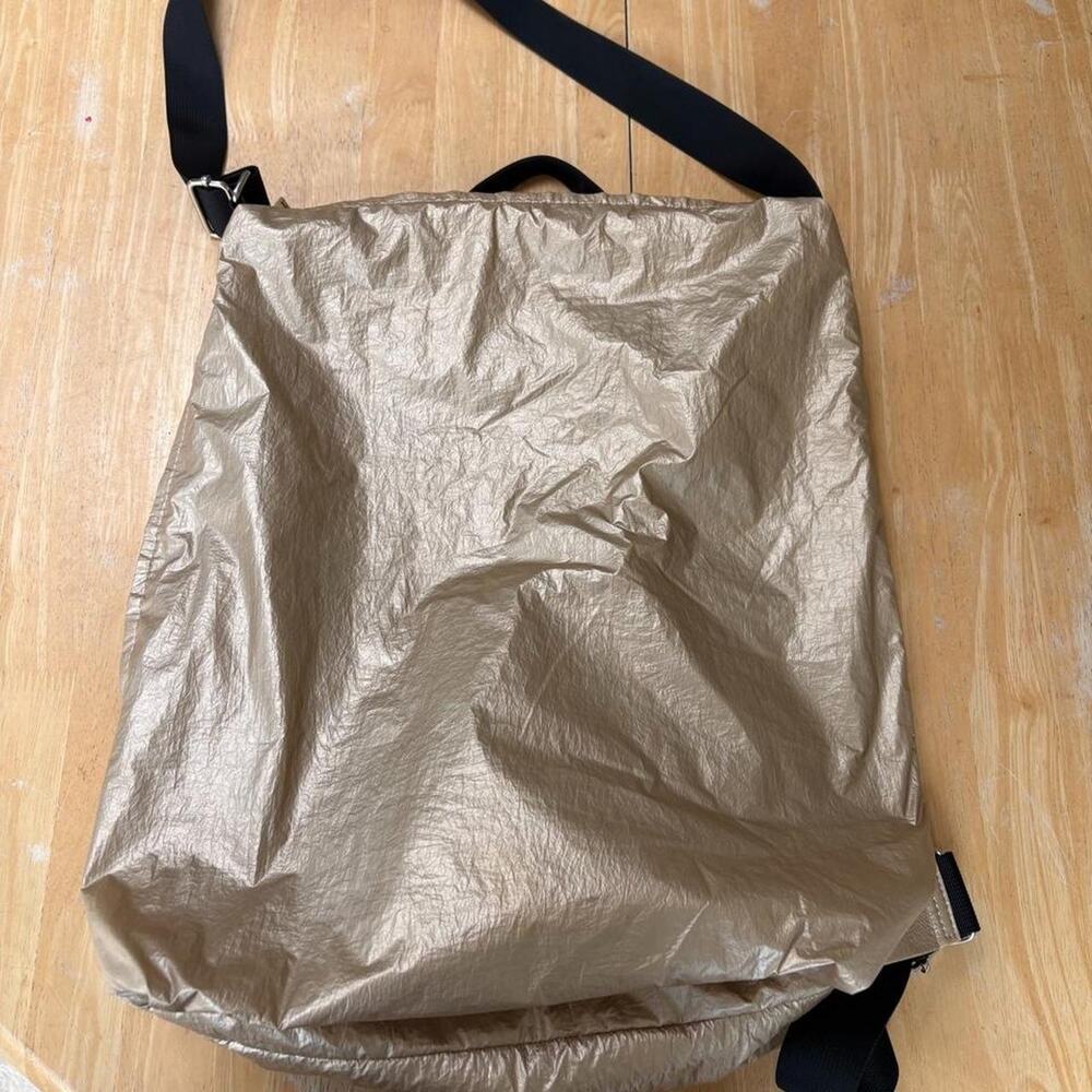 Reserved gold metallic backpack with black straps
